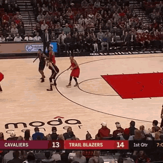 a basketball game is being played between the cavaliers and the trail blazers .