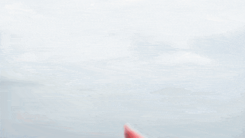 a red object is flying through the air