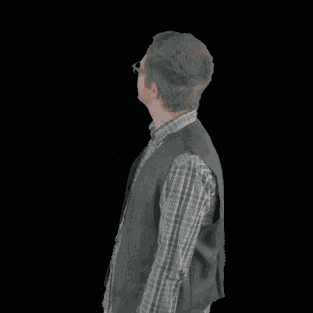 a man wearing glasses and a vest is making a funny face with the word brao next to him
