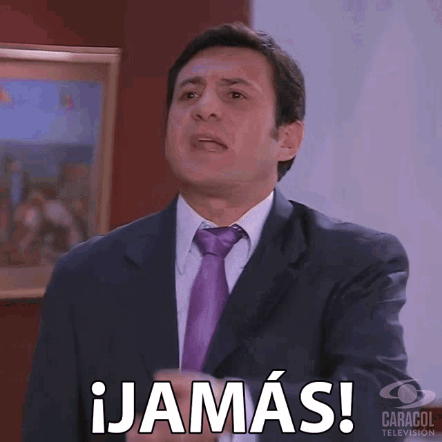 a man in a suit and tie says ¡jamas! in spanish