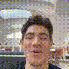 a man is making a funny face with his eyes closed and his mouth open