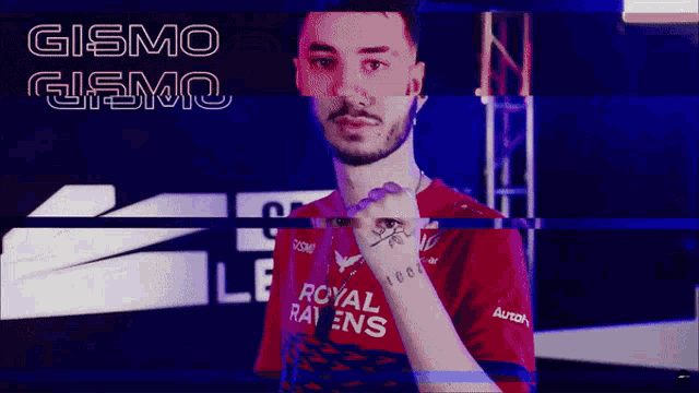 a man wearing a red royal ravens jersey