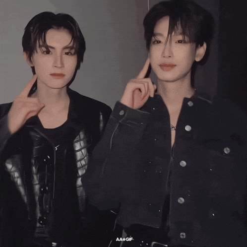a couple of young men standing next to each other with the word aae gif on the bottom left