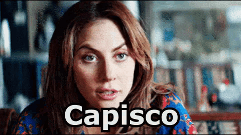 a close up of a woman 's face with the word capisco above her