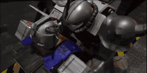 a robot is sitting on top of a blue box with the letters ecl on it