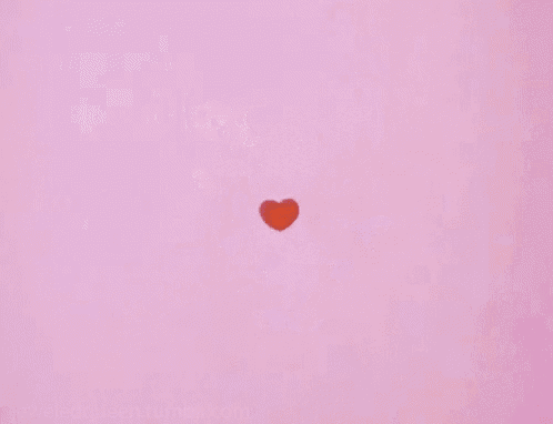 a bunch of red hearts are falling on a pink background