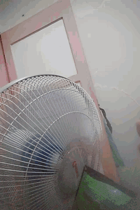 a fan that says ' panasonic ' on it is turned on