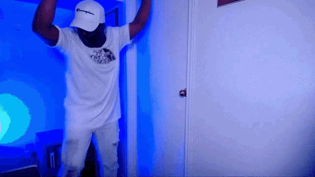 a man wearing a white champion hat and a white shirt