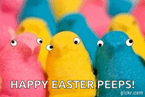 a bunch of peeps are standing next to each other on a pink background .
