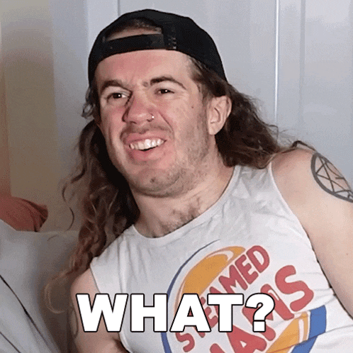 a man with long hair is wearing a tank top that says steamed asis