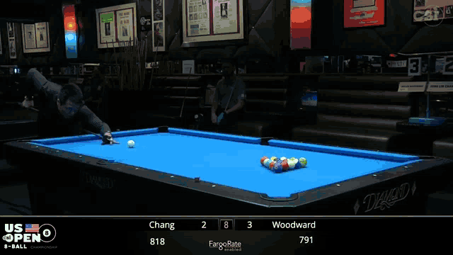 a pool table with a blue cloth says diamond on it