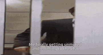 a person is standing in front of a mirror and talking about getting unmuted and entering to the chat .