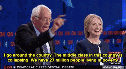 a man and a woman are giving a speech and the man is pointing