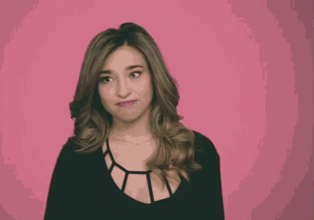 a woman is making a face and says sorry