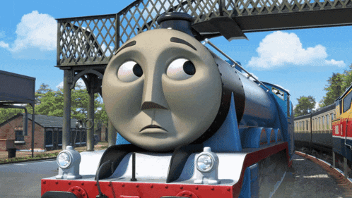 a blue and white train with a sad face