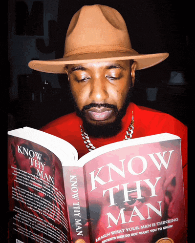 a man in a hat is reading a book titled know thy man