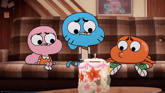 three cartoon characters are sitting on a couch and one of them has a pink shirt on