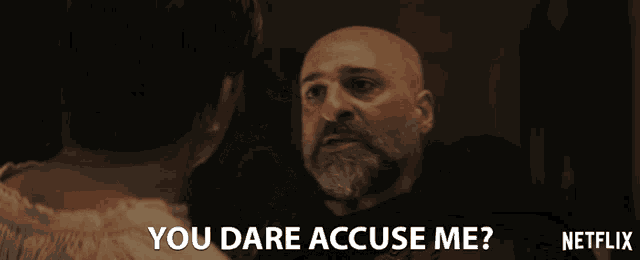 a man with a beard says " you dare accuse me " in a netflix advertisement