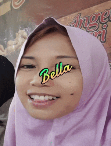 a woman wearing a purple hijab with the word bella on her face