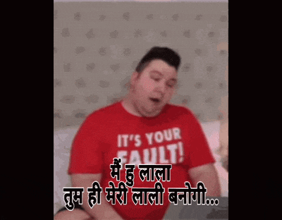 a man wearing a red shirt that says it 's your fault .