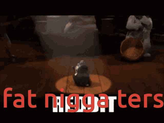 a cartoon of a rat wearing a hat and chains with the words fat niggarters in red
