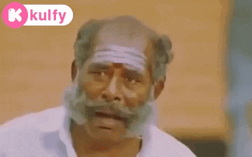 a man with a beard and mustache is making a funny face