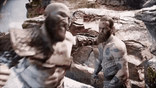 a man with a beard is fighting another man with a sword in a video game .