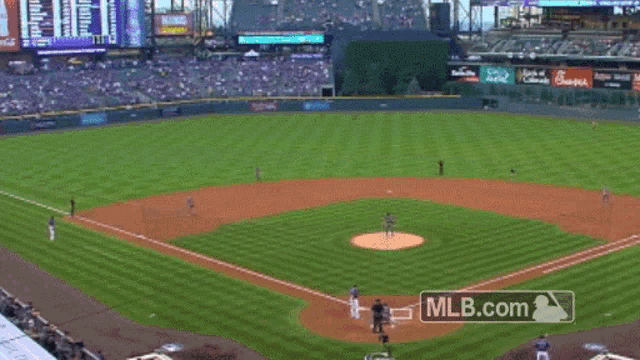 a baseball game is being played with a mlb.com logo in the background