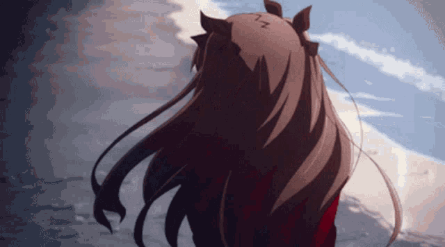 a girl with long hair has the letter n written on her head