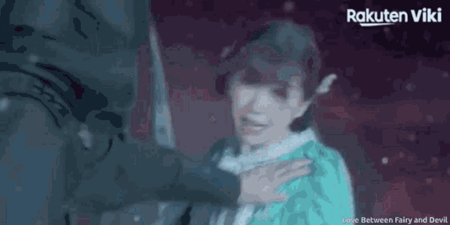 a woman is being held by a man in a rakuten viki video