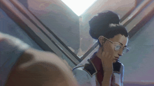 a woman with glasses and a bun is looking at herself in a mirror