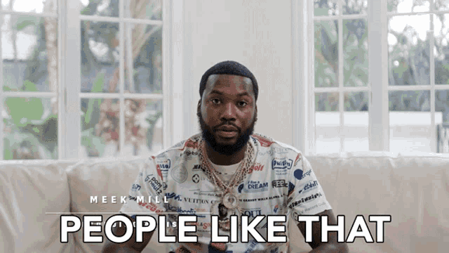 a man sitting on a couch with the words " people like that " above him