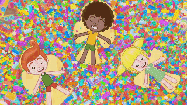 three children are laying on a pile of colorful confetti