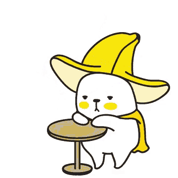 a cartoon dog wearing a banana hat and cape sits at a table