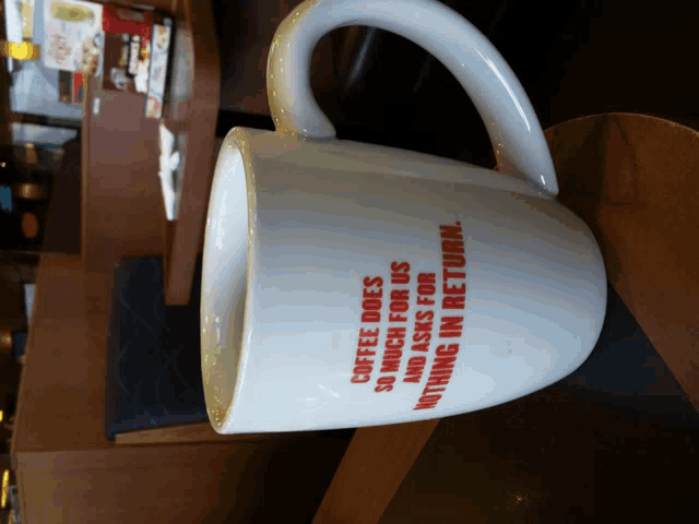 a coffee mug that says " coffee does so much for us "