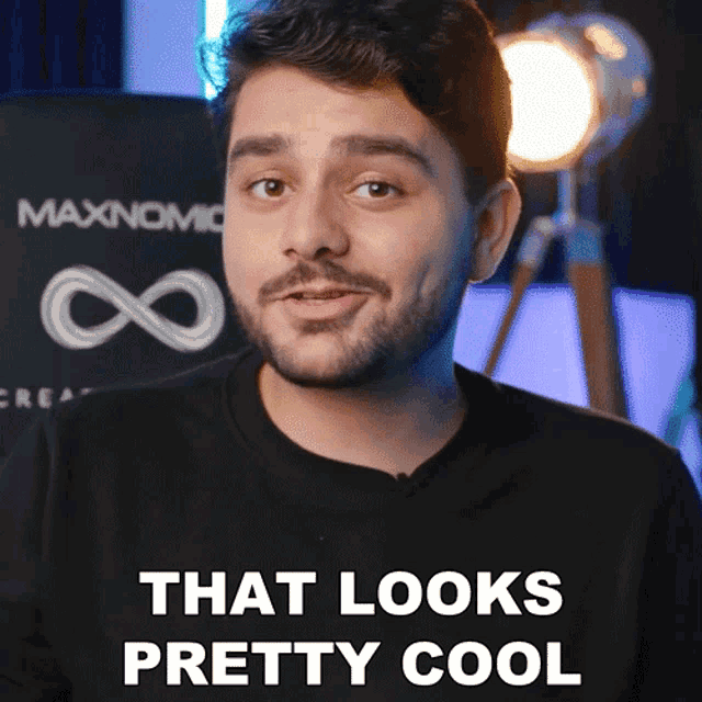 a man says that looks pretty cool in front of a maxnomic logo
