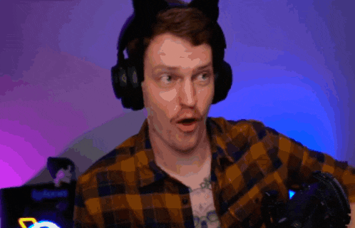 a man in a plaid shirt is wearing headphones