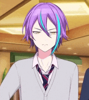 a boy with purple hair and blue streaks is wearing a tie and a cardigan .