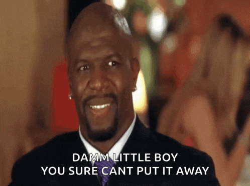a man in a suit and tie is smiling and says damm little boy you sure cant put it away