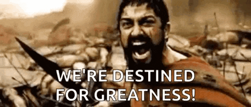 a man with a beard is holding a sword and screaming in a movie scene .