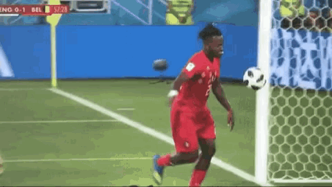 a soccer player with the number 3 on his jersey is running towards the goal .