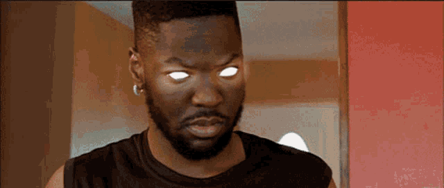 a man with a beard and glowing eyes