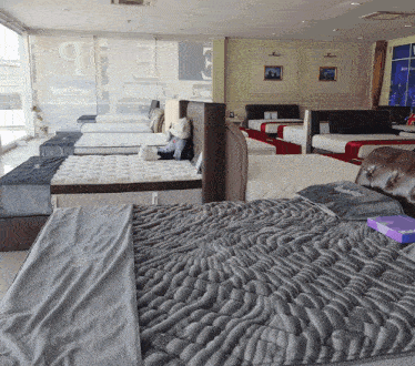 a bed with a gray blanket that says ' king size ' on it