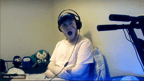 a man wearing headphones and a hat with chop thewanderer written on the bottom