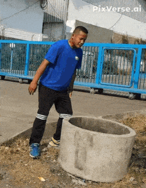 a man in a blue shirt is standing next to a concrete ring with pixverse.ai written on the bottom right