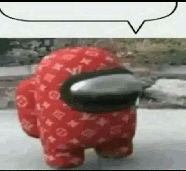 a red among us character wearing a louis vuitton outfit is standing next to a speech bubble .