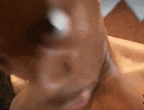 a close up of a person 's face and neck