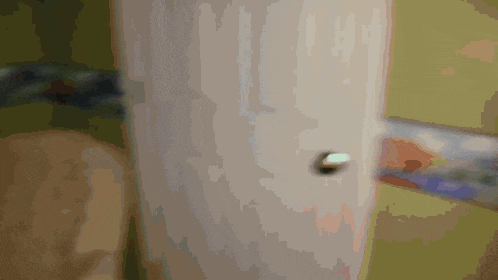 a person is opening a door with a card in it