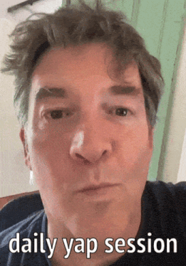 a close up of a man 's face with the words daily yap session on the bottom