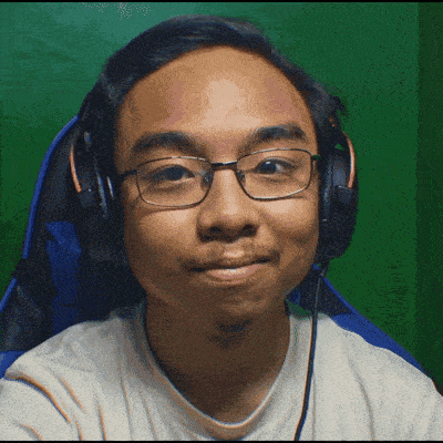 a man wearing glasses and headphones is smiling